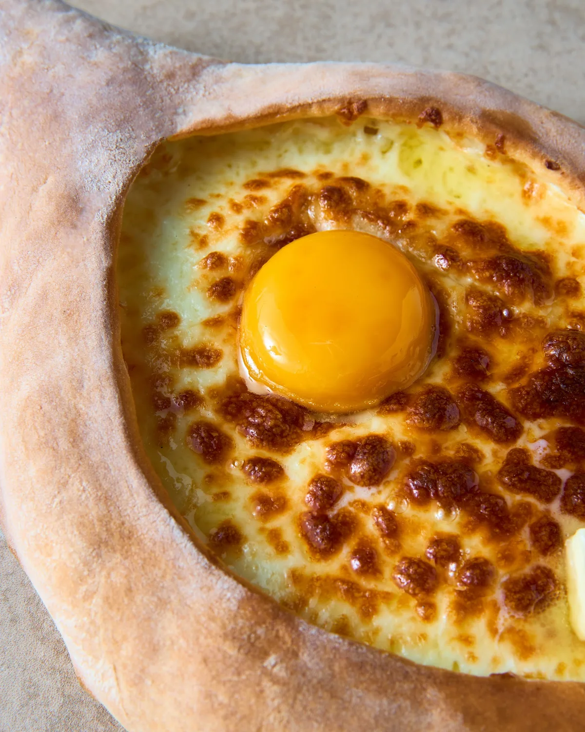 Adjarian khachapuri with egg and butter