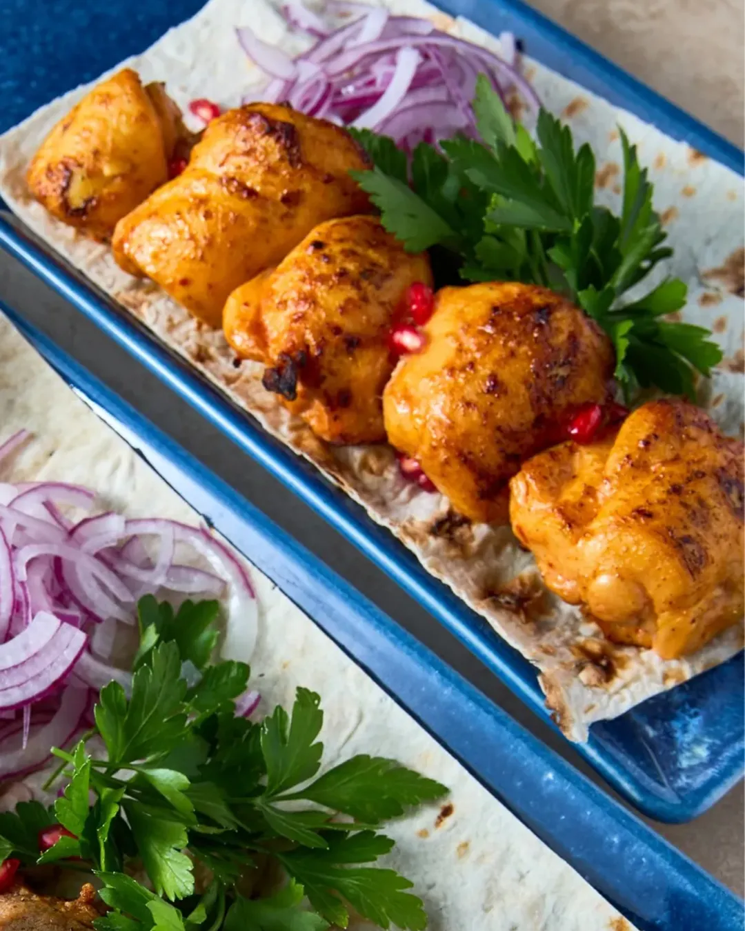 Grilled mtsvadi on lavash with red onions